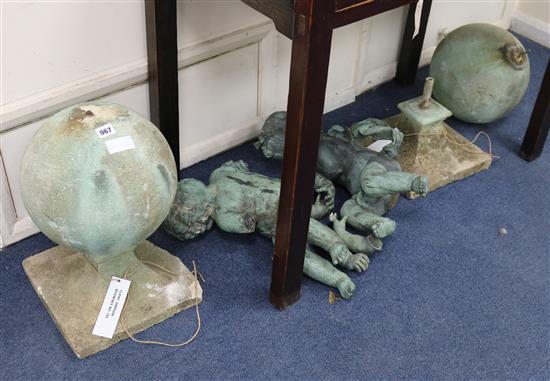 Two lead cherub sculptures on orbs Bases W.30cm